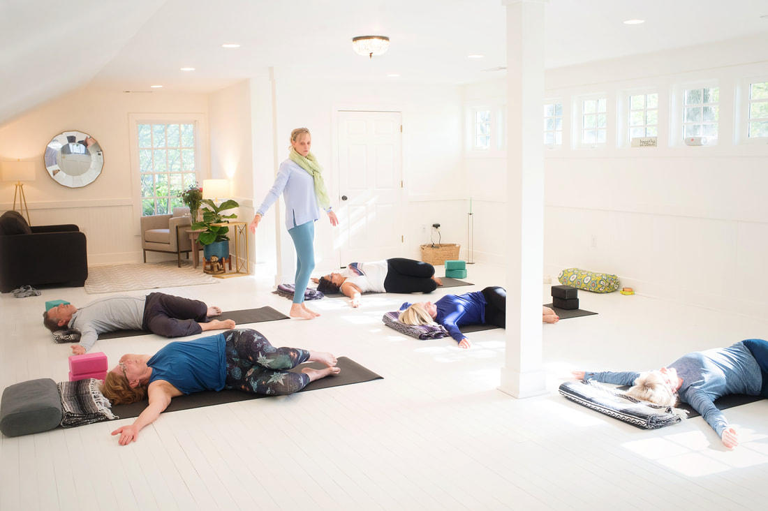 Image - a group of people practicing yoga at the Amy Lloyd Studio - Amy Lloyd Wellness & Yoga, Roswell, GA